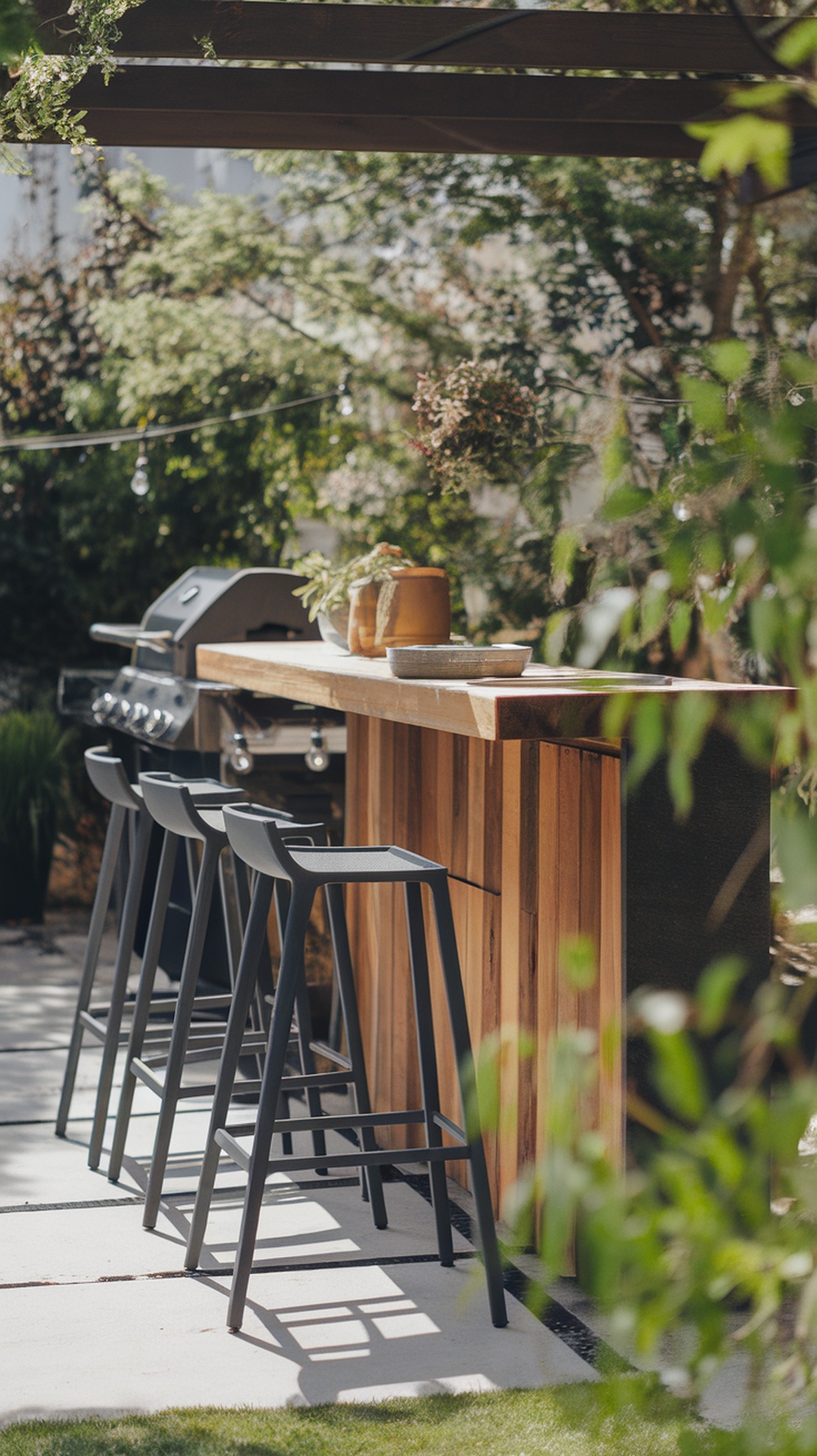 A backyard area featuring a bar-height counter with stools, perfect for casual outdoor meals.