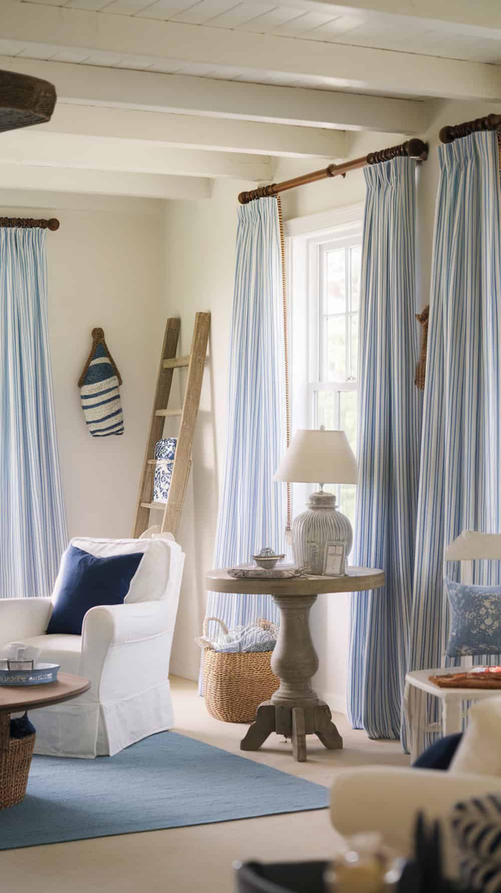 Coastal living room with soft blue and white striped curtains
