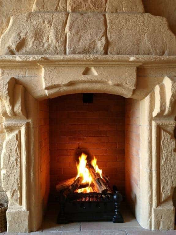sculpted sandstone fireplace elegance